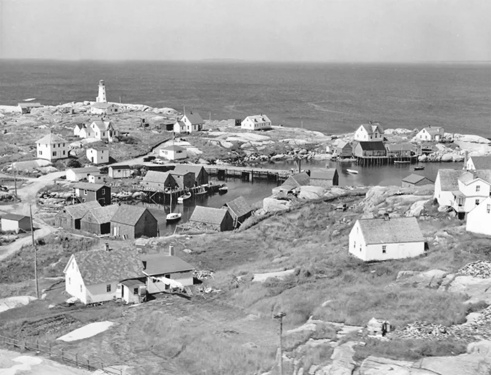 Peggy’s Point Lighthouse in 1955 with Peggy’s Cove in foreground
