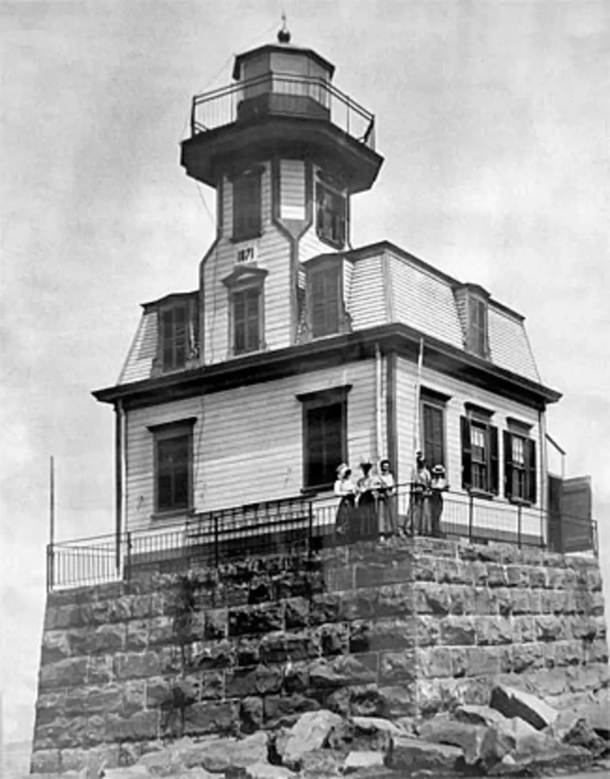 a historic photo of the lighthouse at its original location on a square crib southwest of South Hero Island and about 7 miles (11 km) northwest of Burlington.